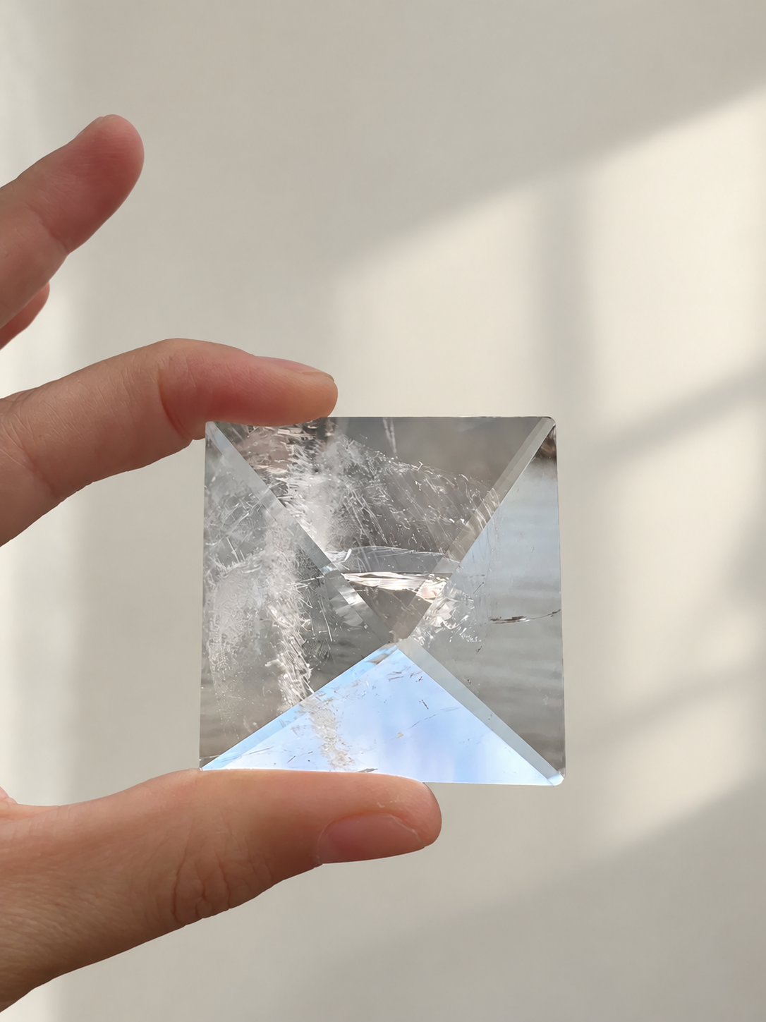 Natural Clear Quartz Pyramid, detailed view 5 in soft indoor light.