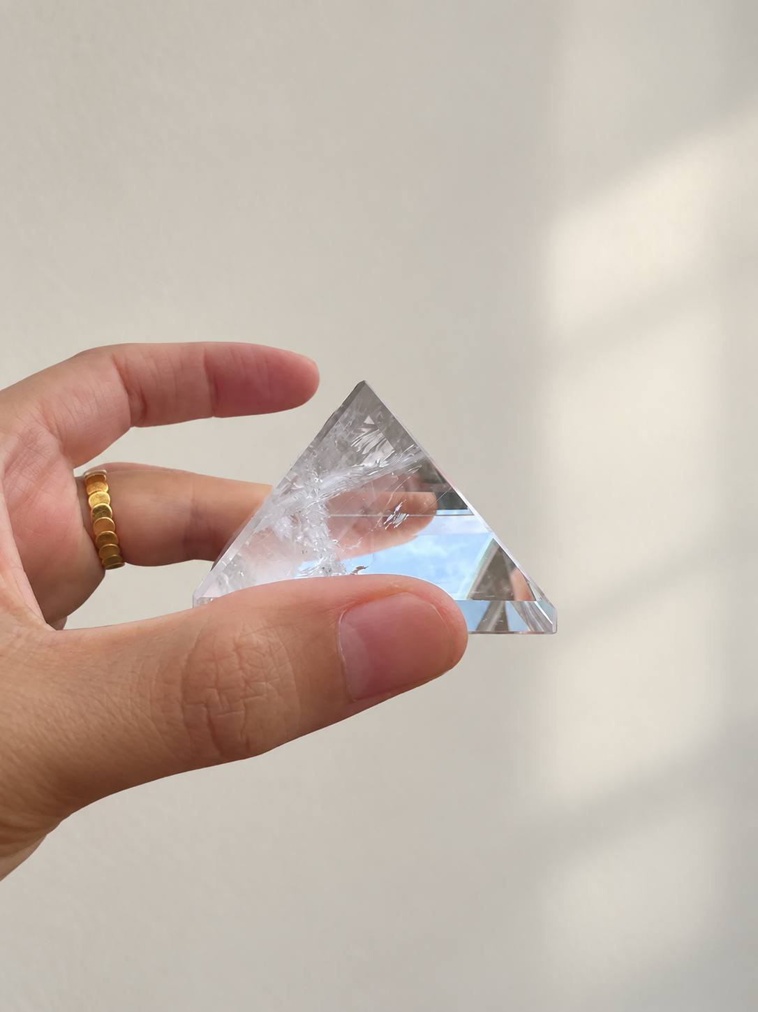 Natural Clear Quartz Pyramid, detailed view 8 in soft indoor light.