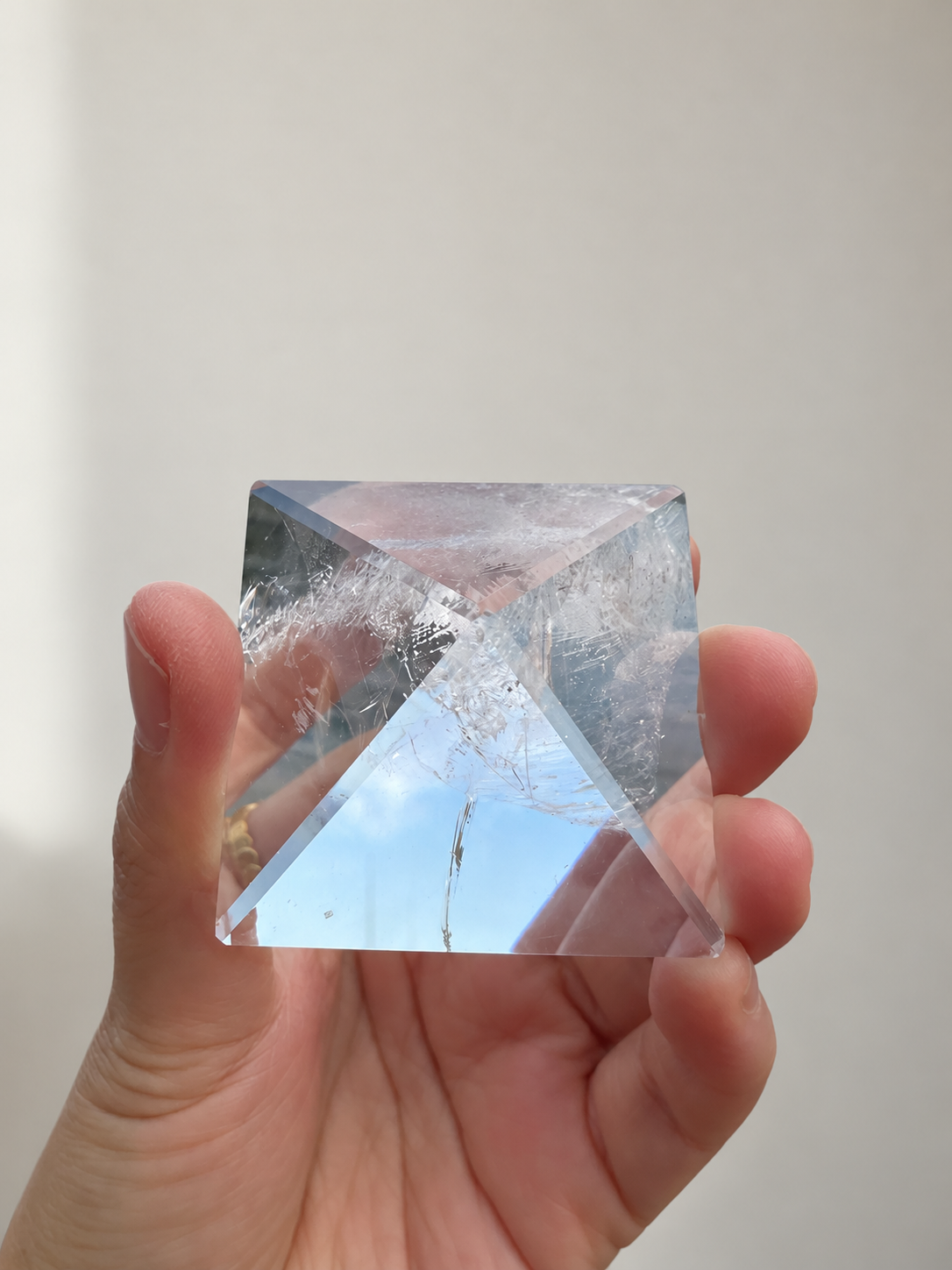 Natural Clear Quartz Pyramid, detailed view 9 in soft indoor light.