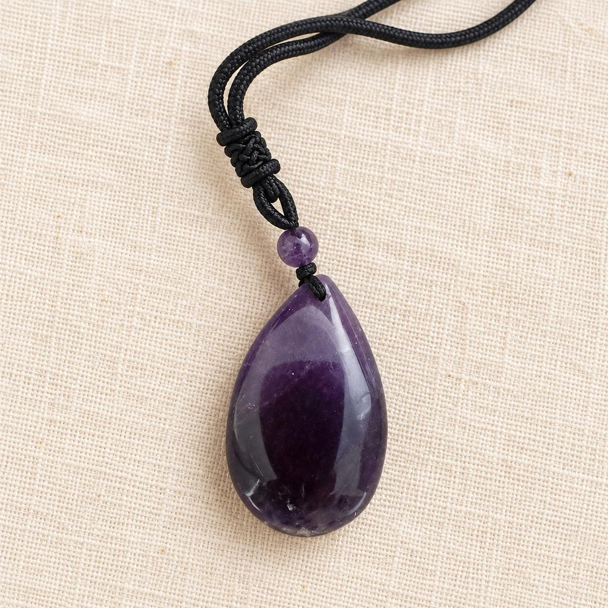 Natural Rose Quartz or Dream Amethyst teardrop pendant from Madagascar with adjustable cord