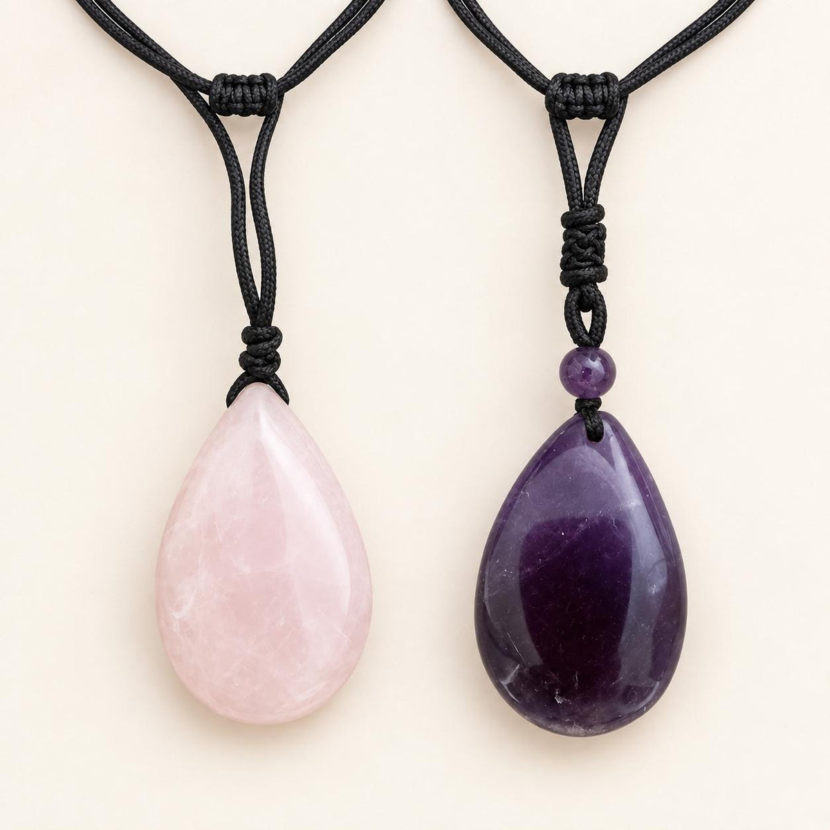 Polished 4cm Rose Quartz or Dream Amethyst crystal pendant necklace showing natural colour variation