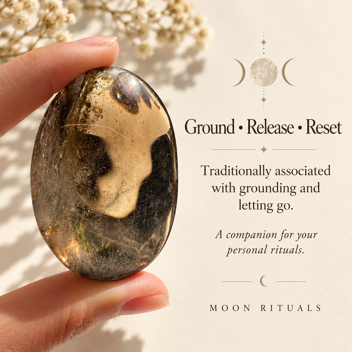 Smoky quartz palm stone with grounding and release symbolism
