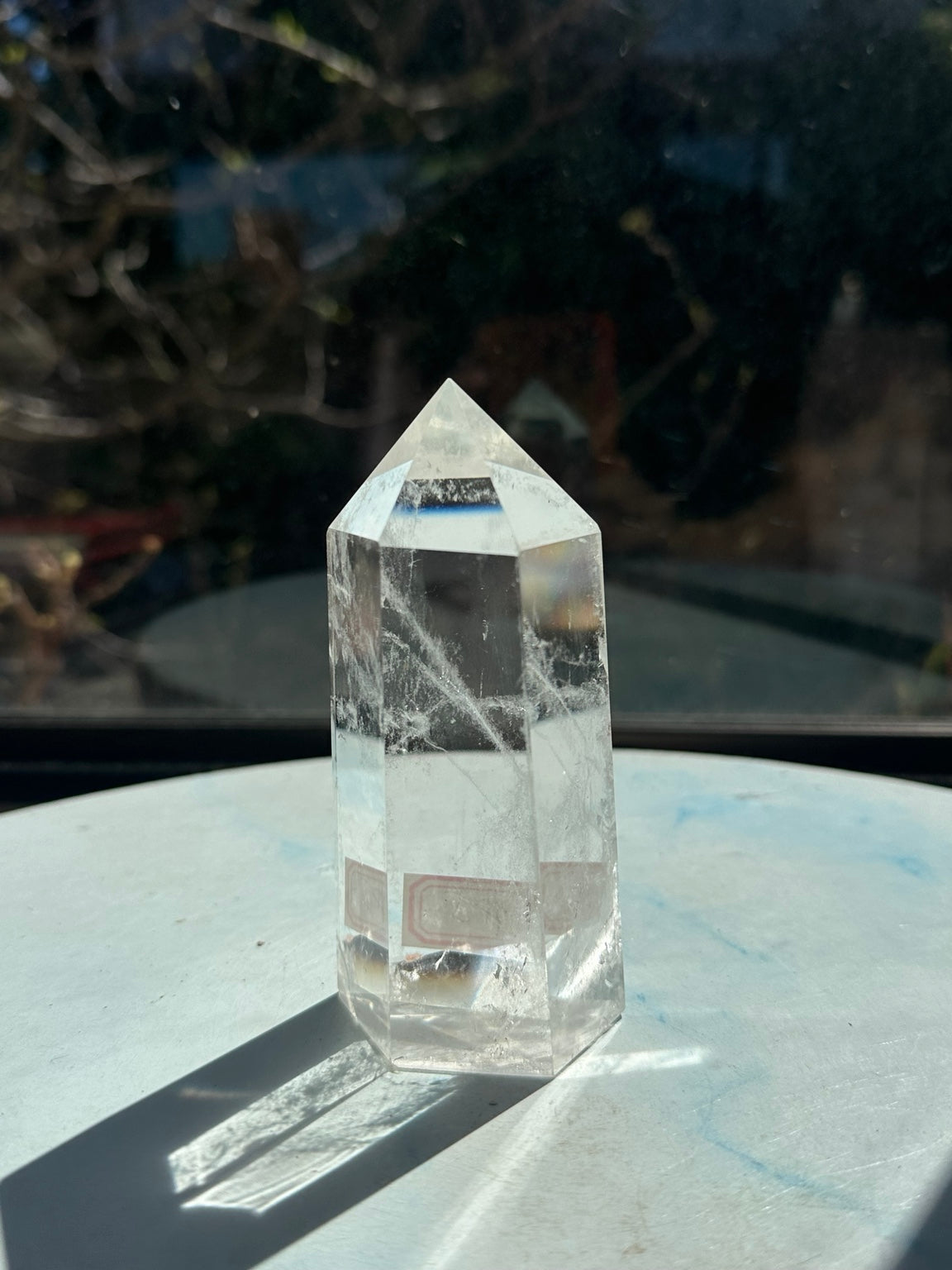 Rear angle of Brazilian clear quartz tower #5 showing transparent faces and wispy white veils