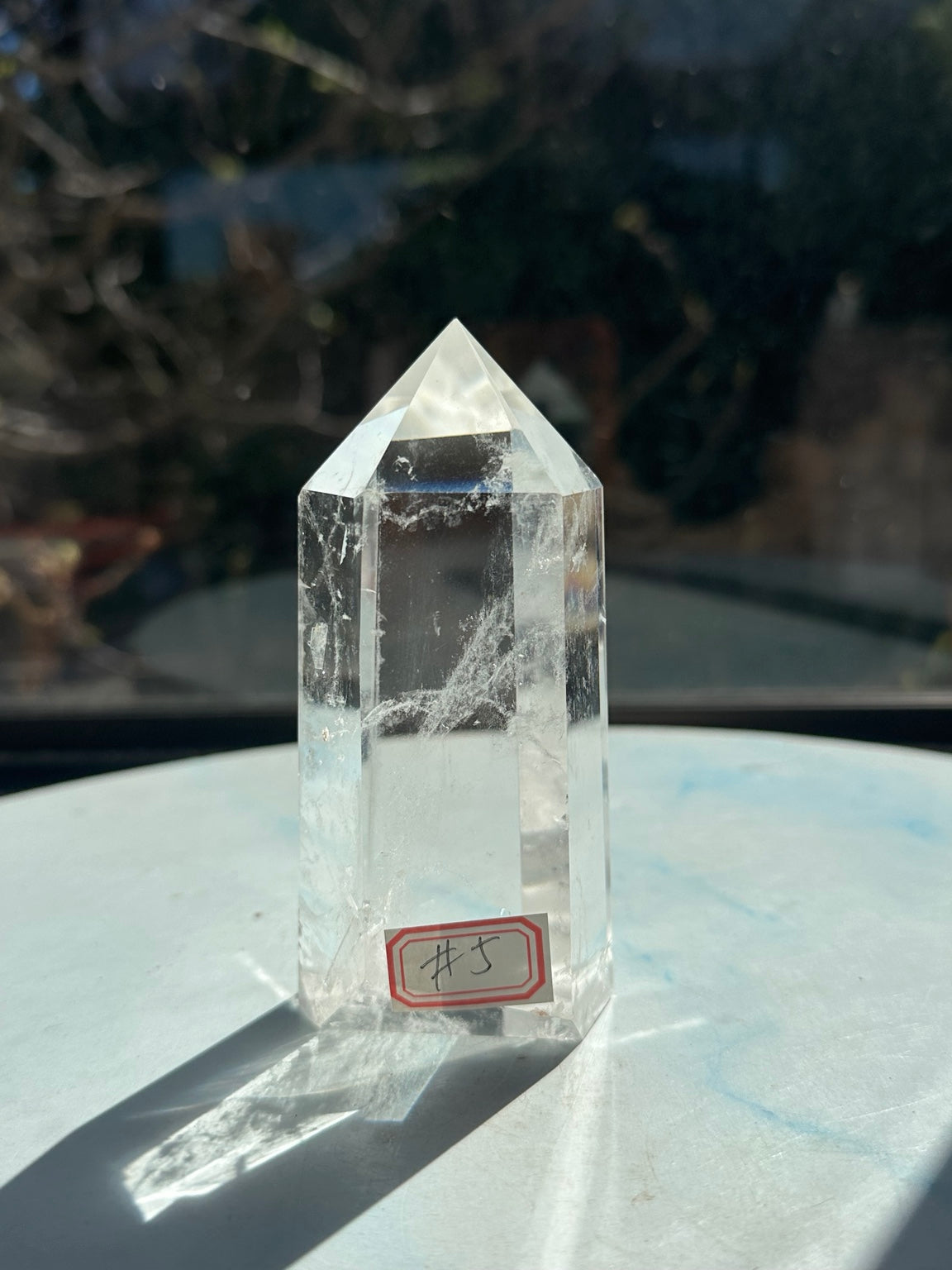Front view of Brazilian ultra clear quartz tower #5, 356g and 11cm tall, with number label