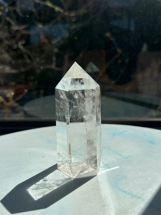 Side view of ultra clear quartz tower #5 showing broad transparent areas and delicate white veils