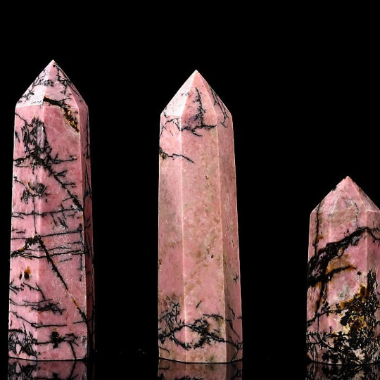 Rhodonite tower close-up with natural dark mineral veining