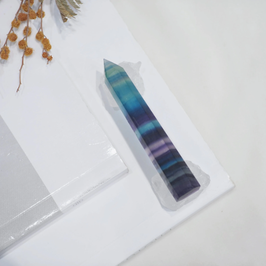 Polished Rainbow Fluorite tower detail with natural green and violet tones